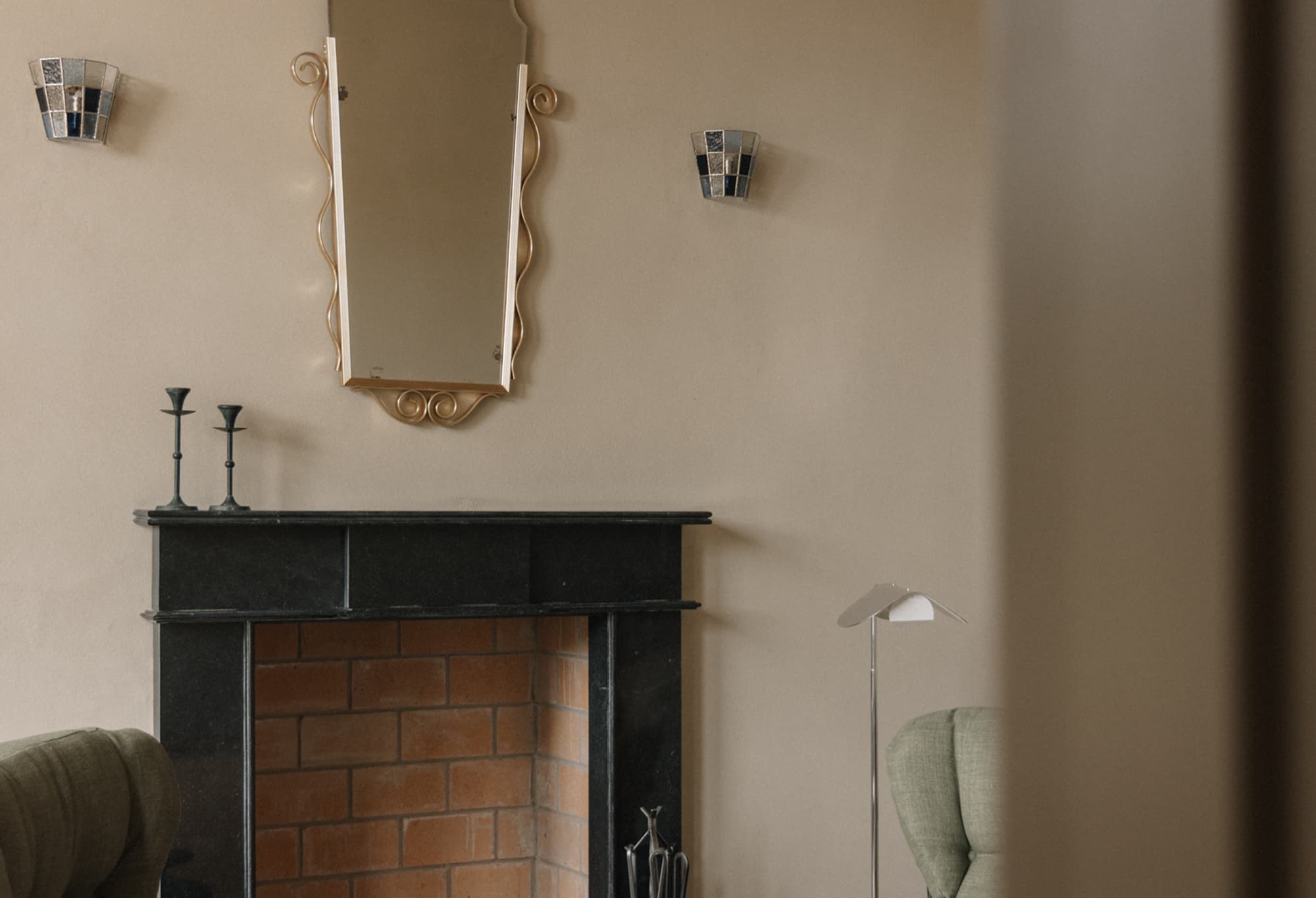 The guesthouse sitting room with fireside chairs and warm tones