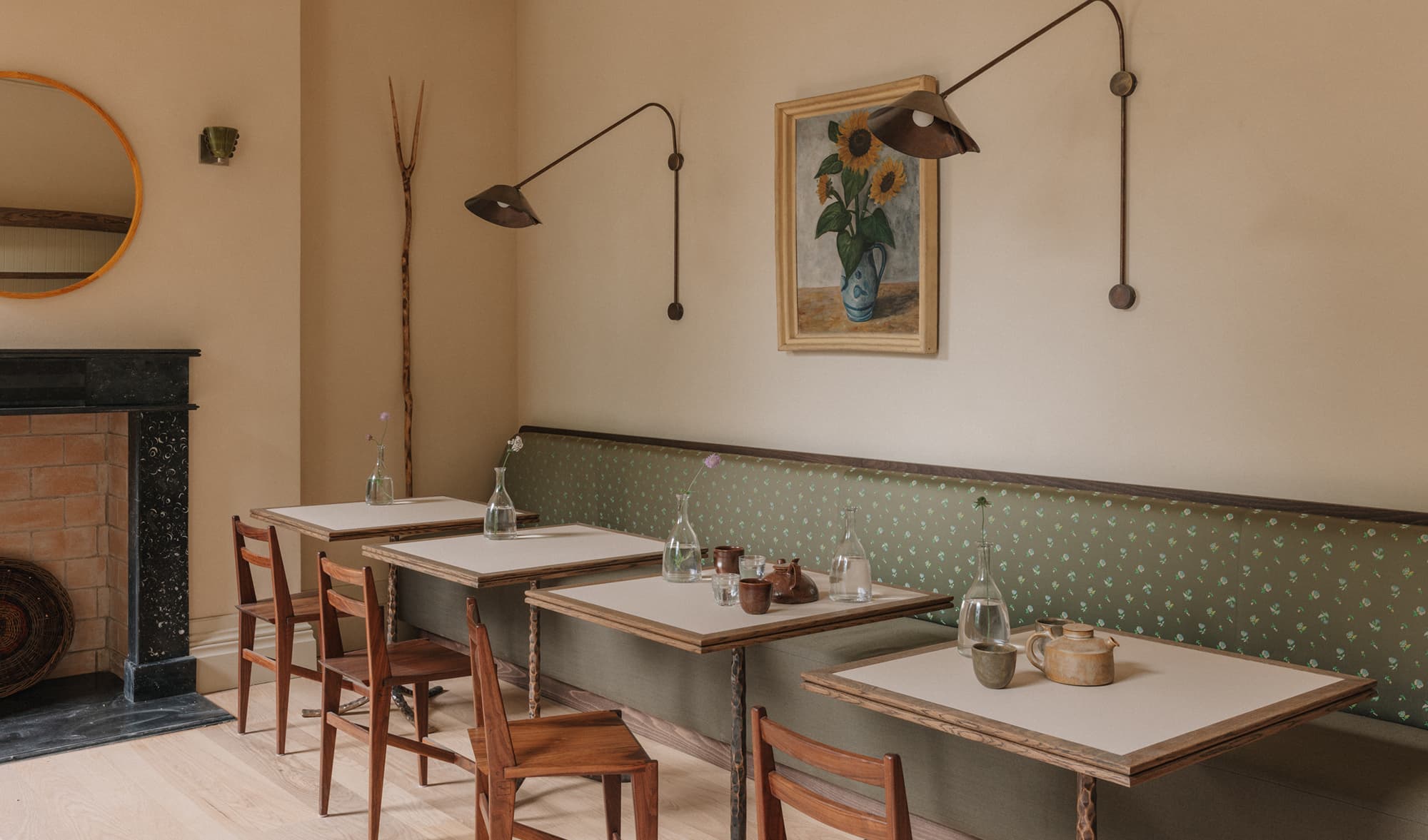 The guesthouse breakfast room with colourful furniture and sunlit tiled floor