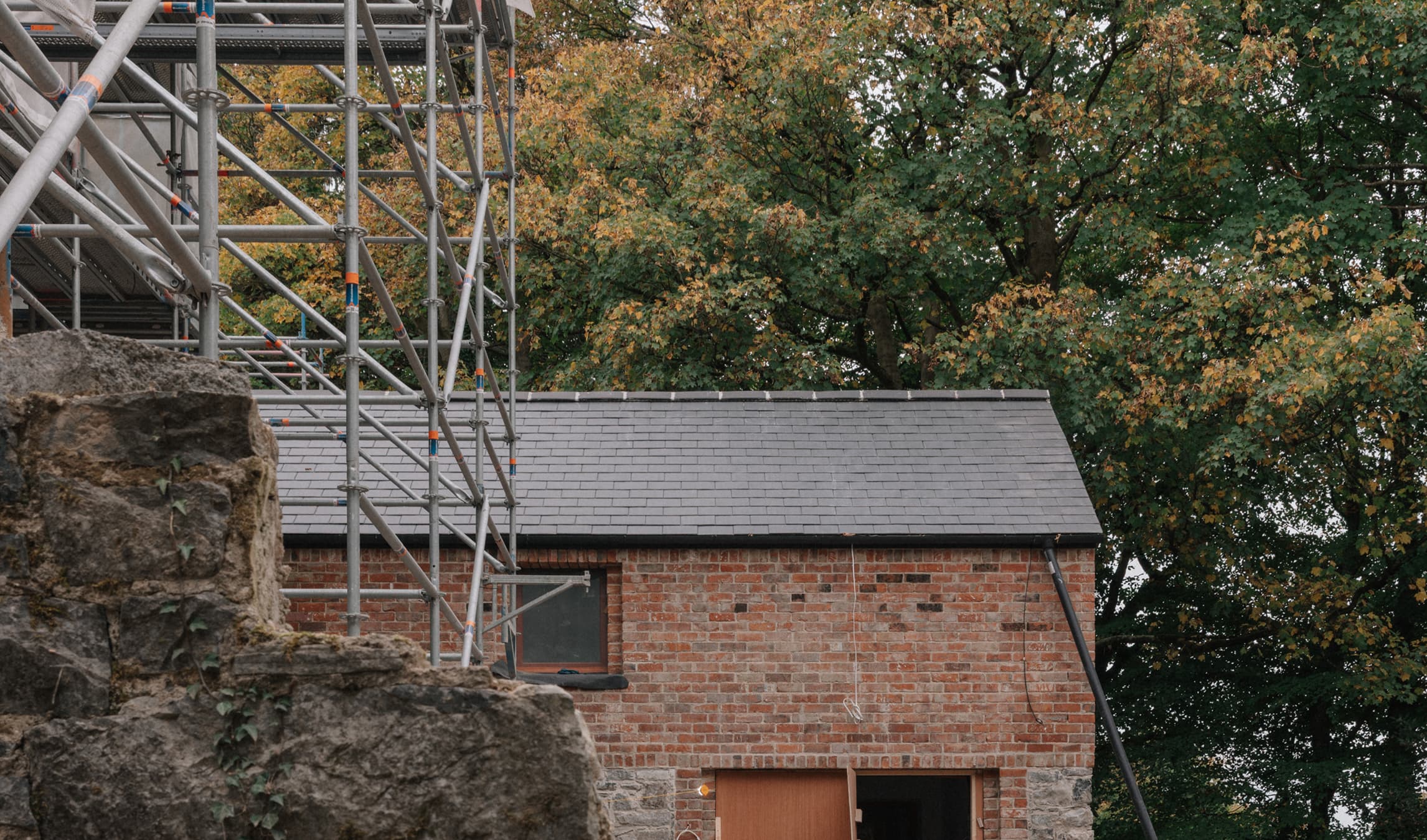 The guesthouse breakfast room with colourful furniture and sunlit tiled floor